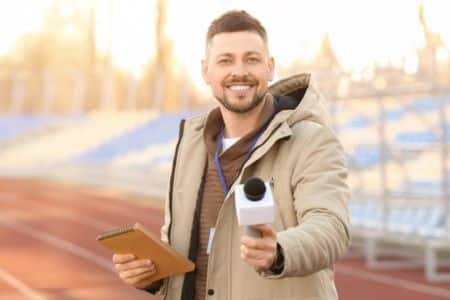 man interviewing on a track field.