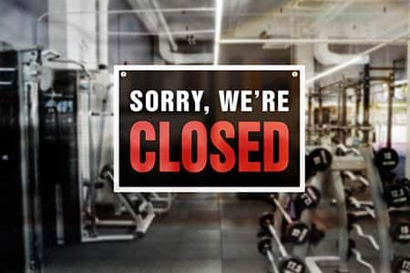 closed sign on a gym door.