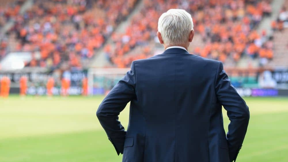 Soccer coach analyzing the game.