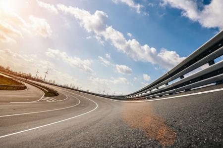 An empty NASCAR track with clouds above