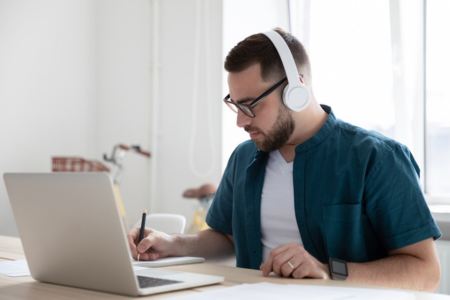 A person looking up how to become a NASCAR official on a laptop