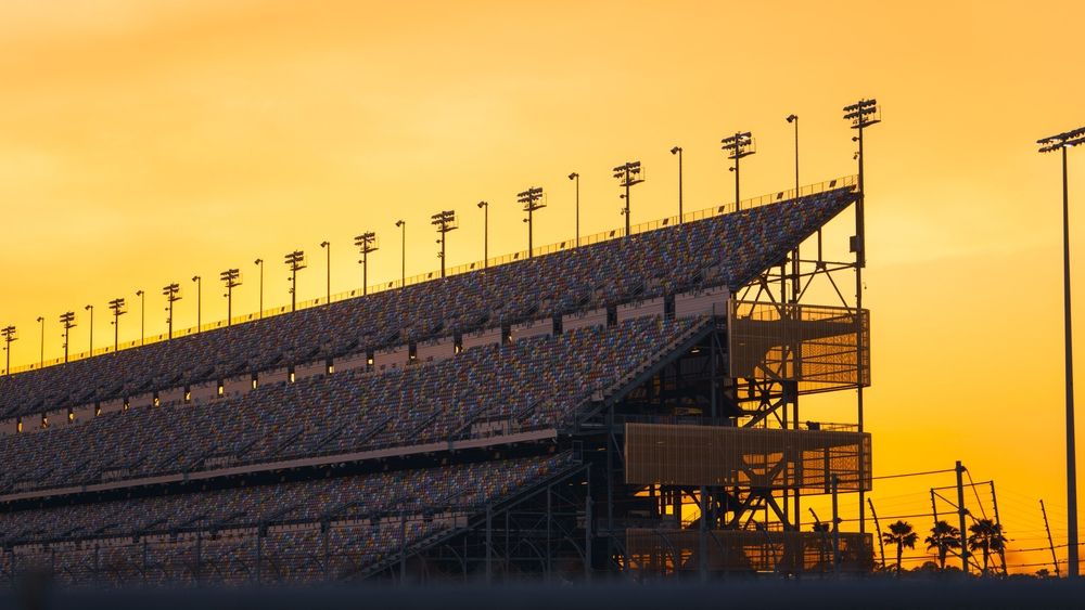 Empty stands of the Daytona Speedway during sunset