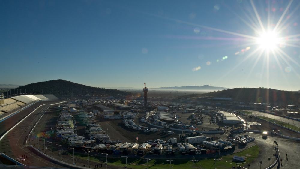 A NASCAR track with fans gathering for the event