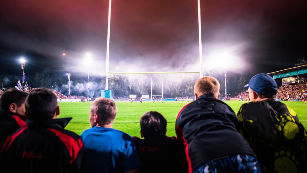 People watching a soccer game from the stands