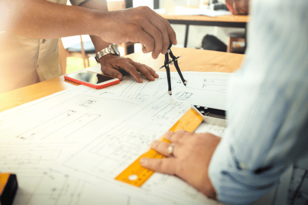 Two architects working on designing a golf course