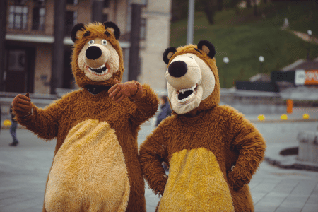 Two mascots offering a local performance