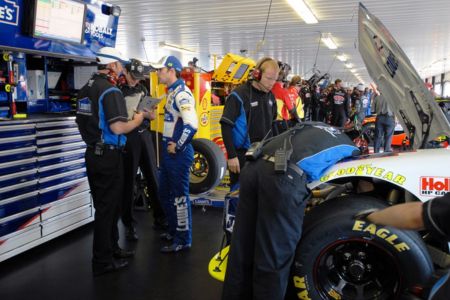 NASCAR crew chief with driver and pit crew