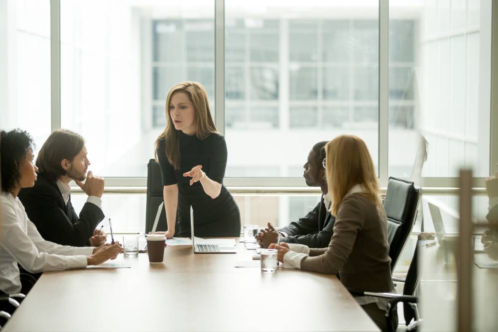 A senior Marketing Director works with her team on a project.