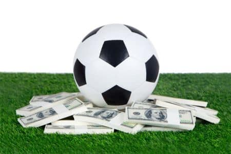 Soccer ball on top of money pile