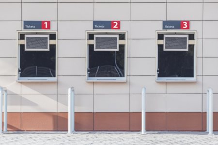 Three ticket booths cut out of the wall