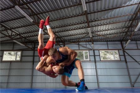 Two wrestlers preparing for WrestleMania