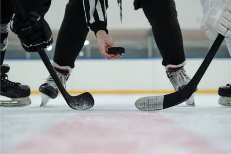 Hockey referee getting ready to drop the puck