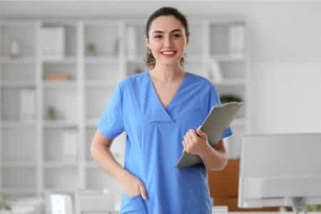 An NFL nurse smiling and looking at the camera