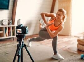 influencer stretching in front of a camera.