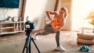 influencer stretching in front of a camera.