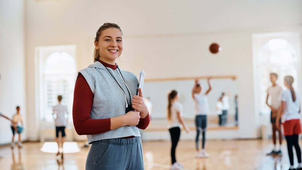 Female PE teacher teaching PE class.