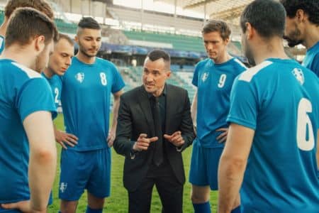 sports manager giving instructions to his players.