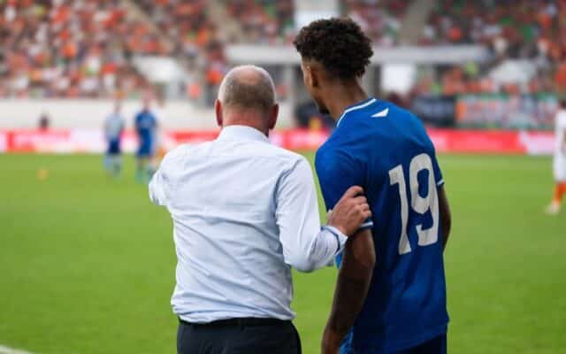 coach giving instructions to a player.