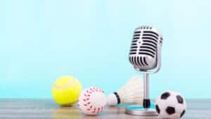 radio microphone surrounded by sports balls.