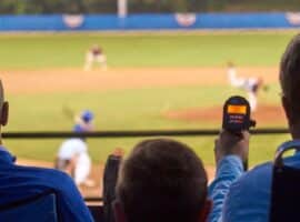 baseball scout using radar during a baseball game