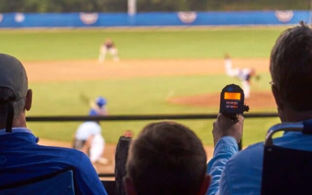 baseball scout using radar during a baseball game