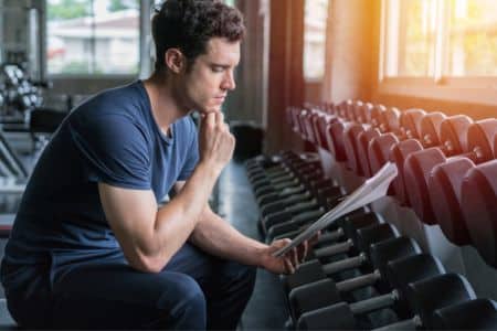 Personal trainer studying for certification.