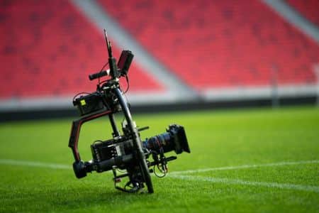 camera lying on a football field.