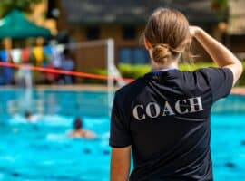 back view of a female swimming coach.