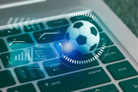 keyboard with data statistics and a football.