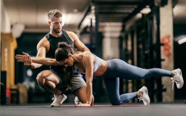 Sports trainer working with an athlete.