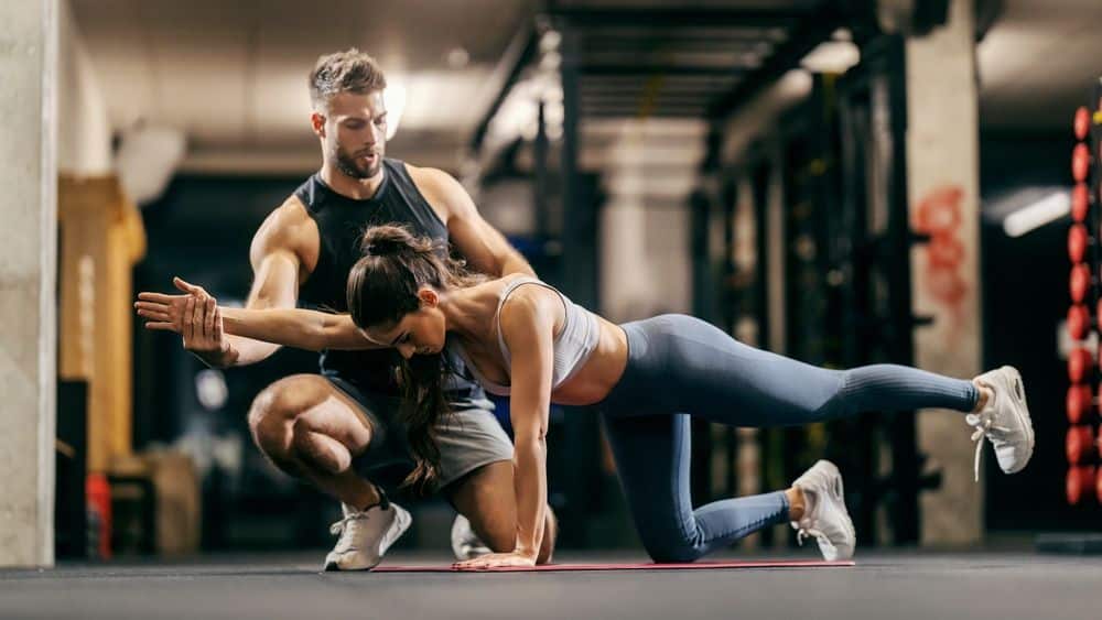 Sports trainer working with an athlete.