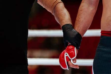 boxing referee ready to declare the winner after the fight.