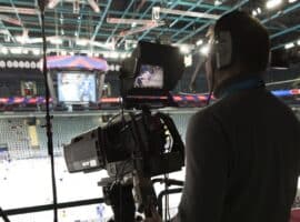 NHL video coach filming game from press box