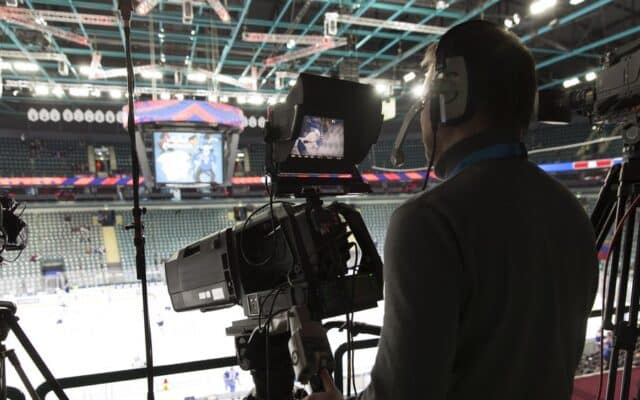 NHL video coach filming game from press box