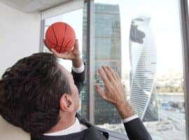 business professional balancing work and basketball