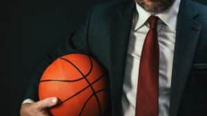 business professional holding a basketball representing NBA corporate careers.