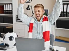 Excited Soccer Fan Working From Office.