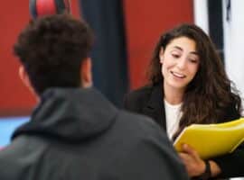 sports social worker meeting one-on-one with a young athlete for support.