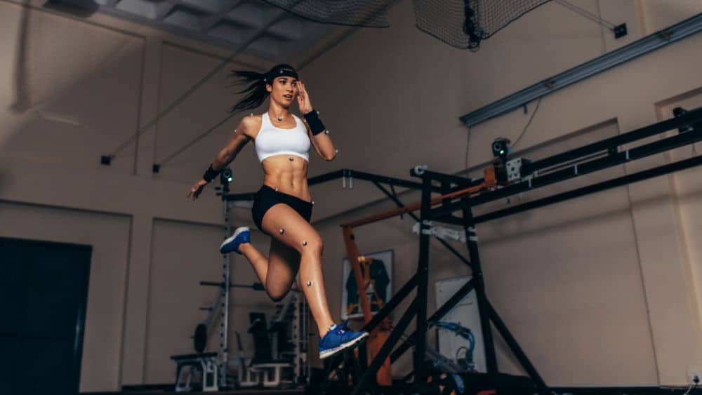 Athlete running in a sports motion capture testing lab